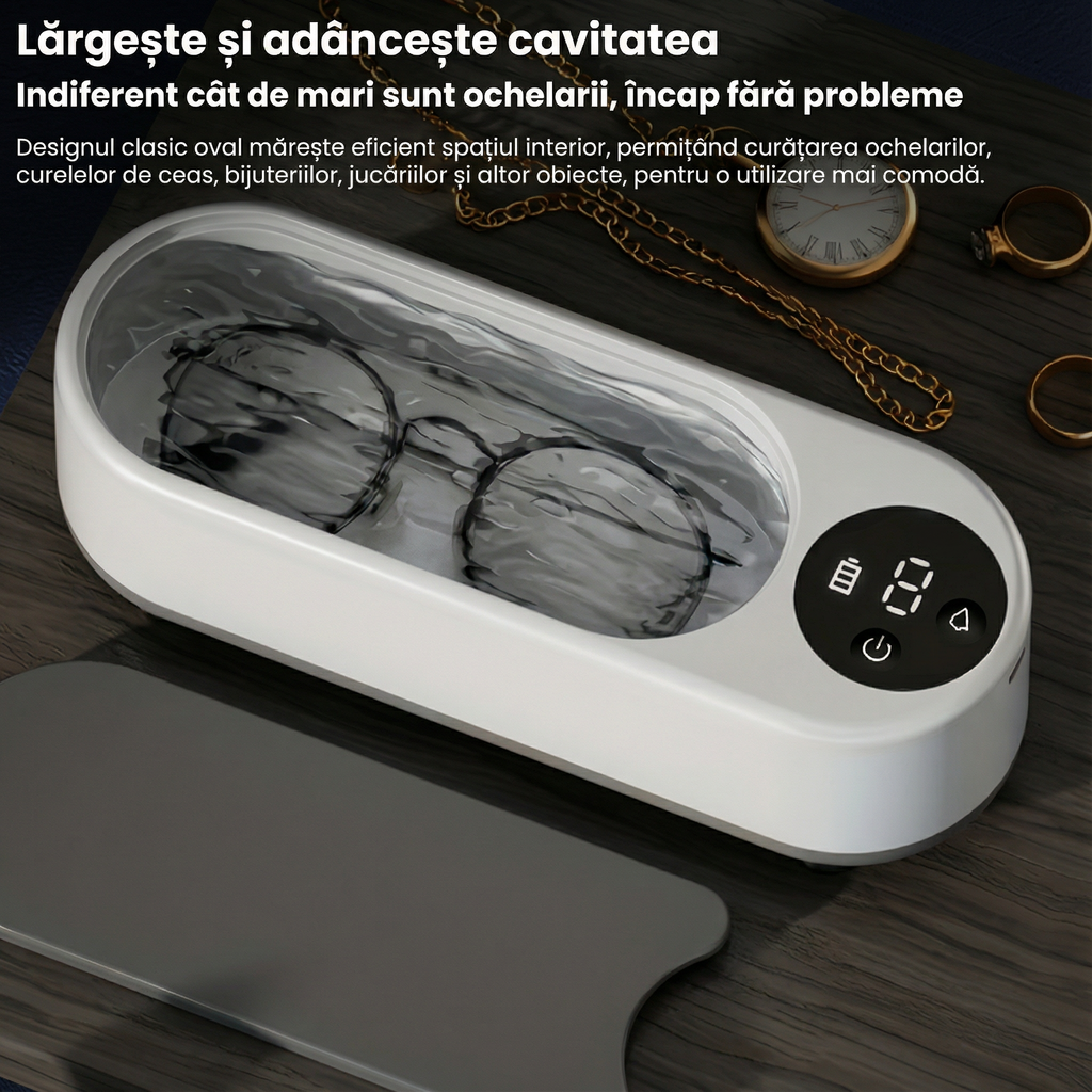 Cuva deschisă, plină cu apă, cu o pereche de ochelari înăuntru, lângă un lanț și inele