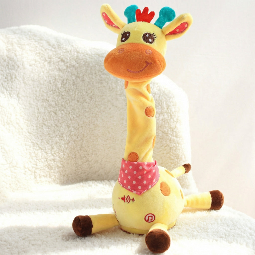 Girafa de pluș așezată pe o pătură albă, cu butoanele de pe burtă la vedere