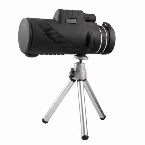 Monocular negru cu rotiță de focalizare, montat pe un trepied mic argintiu