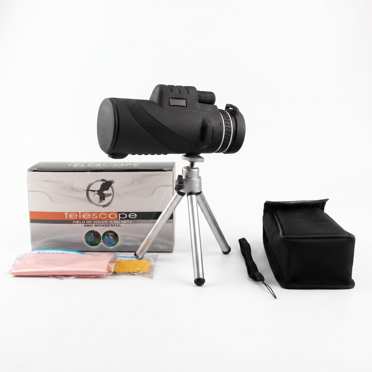 Monocular pe trepied, lângă cutie, husă neagră, șnur de mână și lavete