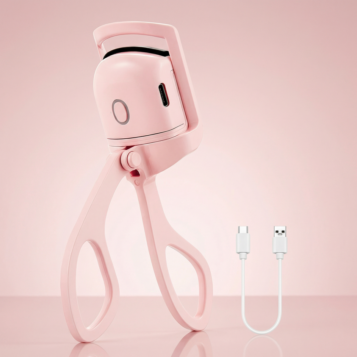 Ondulator de gene roz, cu mânere tip foarfecă, și cablul USB alături